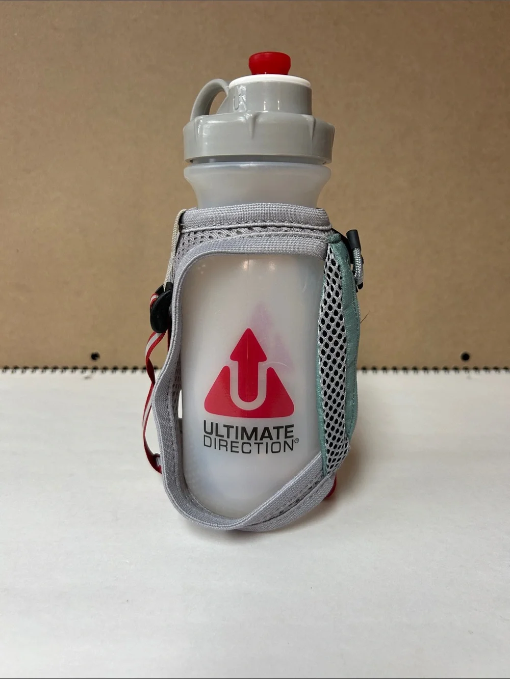 Ultimate Direction White & Red Hand Bottle with Adjustable Strap